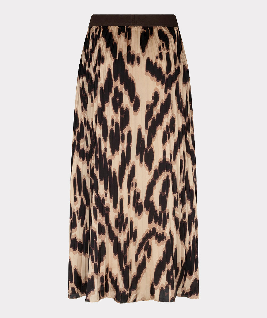 A pleated midi skirt with an abstract leopard print pattern in beige, brown, and black, featuring a solid dark brown waistband, shown against a light gray background.